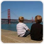 two boys looking at the Golden Gate bridgey